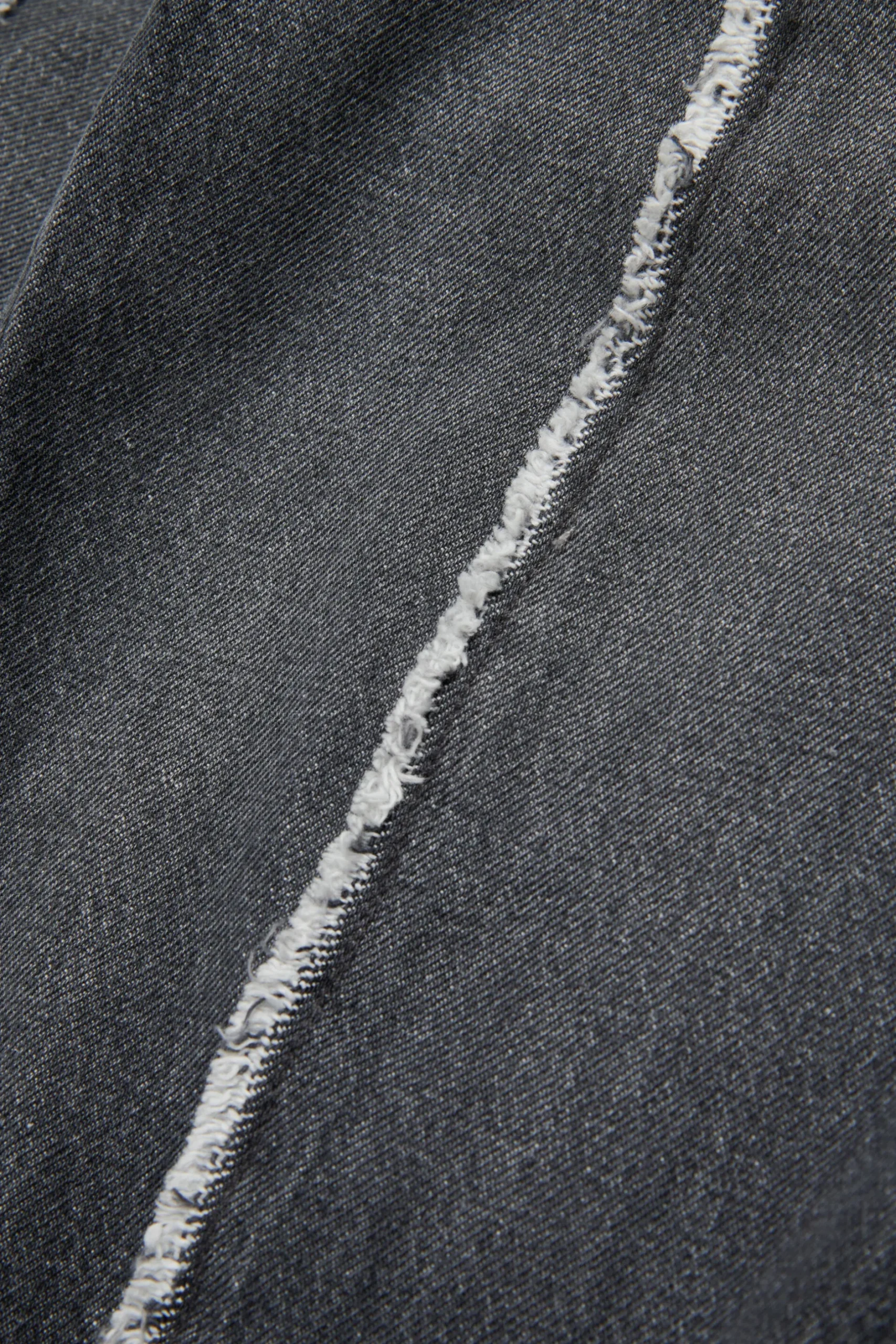 MM6 MAISON MARGIELA Jeans nero con dettagli a taglio vivo | Bambino Jeans | Denim-Mania